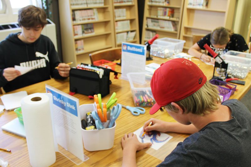 Teens doing activity at library