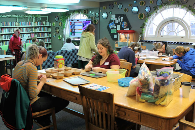Teens doing art at library