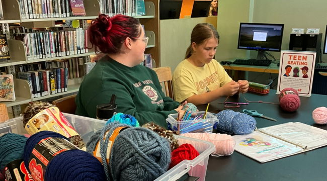 Teens knitting at library